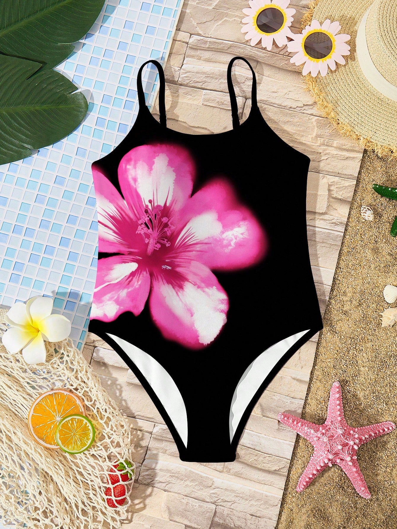 Tween girls multicolor one-piece swimsuit with cut-out detail, spaghetti straps, all-over tie-dye style print, and natural mid-waist bottom for beach and vacation wear.