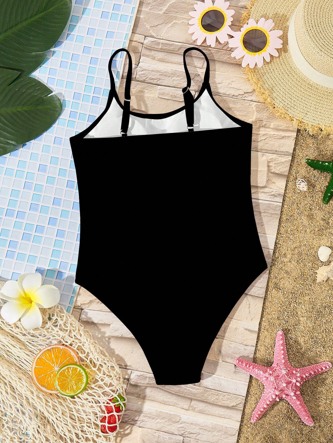 Tween girls multicolor one-piece swimsuit with cut-out detail, spaghetti straps, all-over tie-dye style print, and natural mid-waist bottom for beach and vacation wear.
