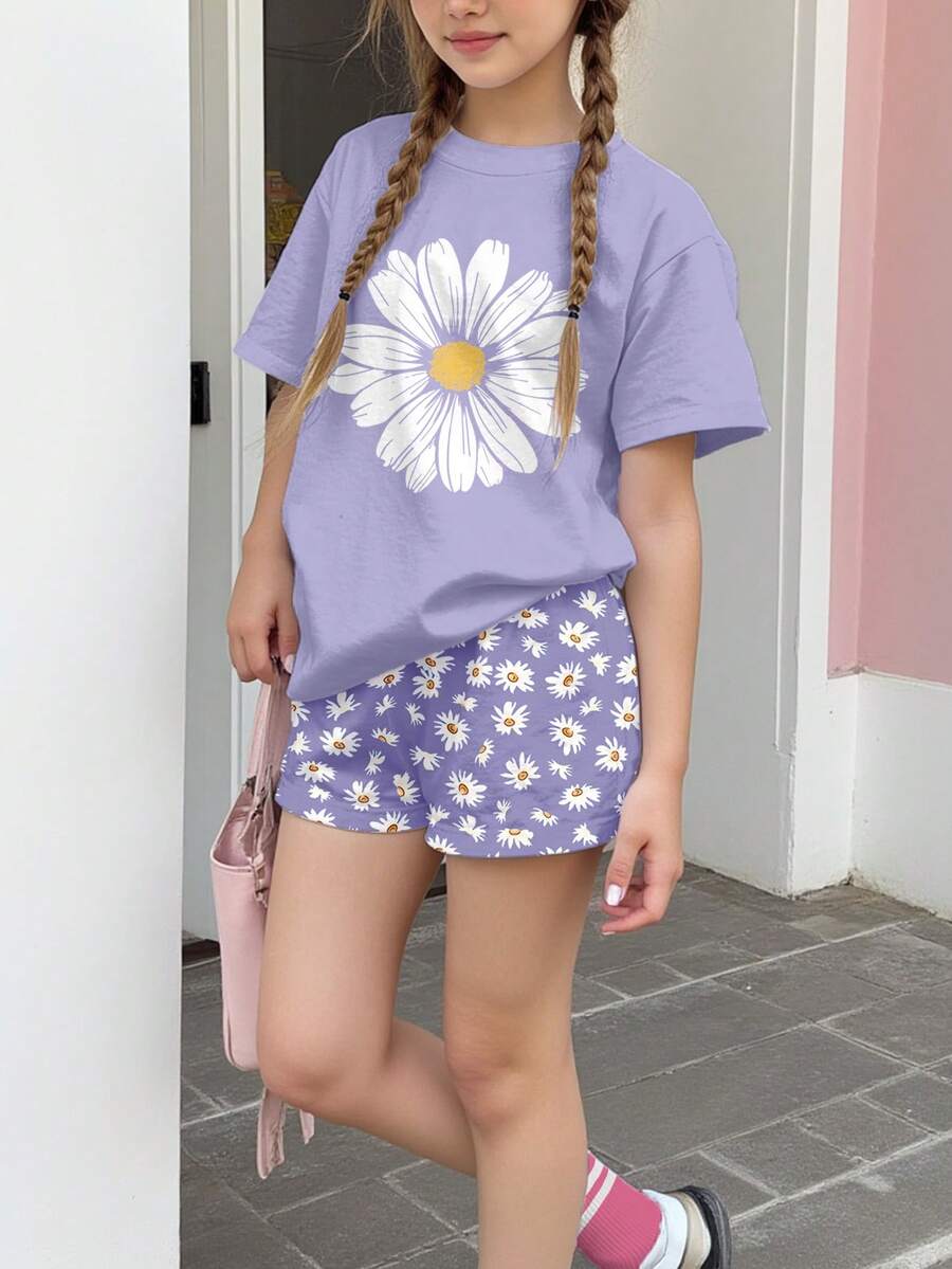 Tween girls 2-piece summer casual outfit featuring a multicolor seashell print short sleeve T-shirt with drop shoulders and matching loose fit shorts with pockets.