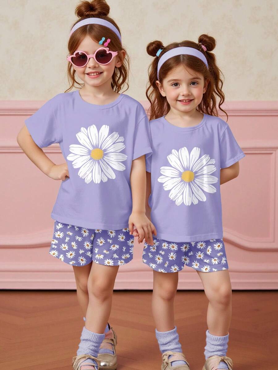 Tween girls 2-piece summer casual outfit featuring a multicolor seashell print short sleeve T-shirt with drop shoulders and matching loose fit shorts with pockets.