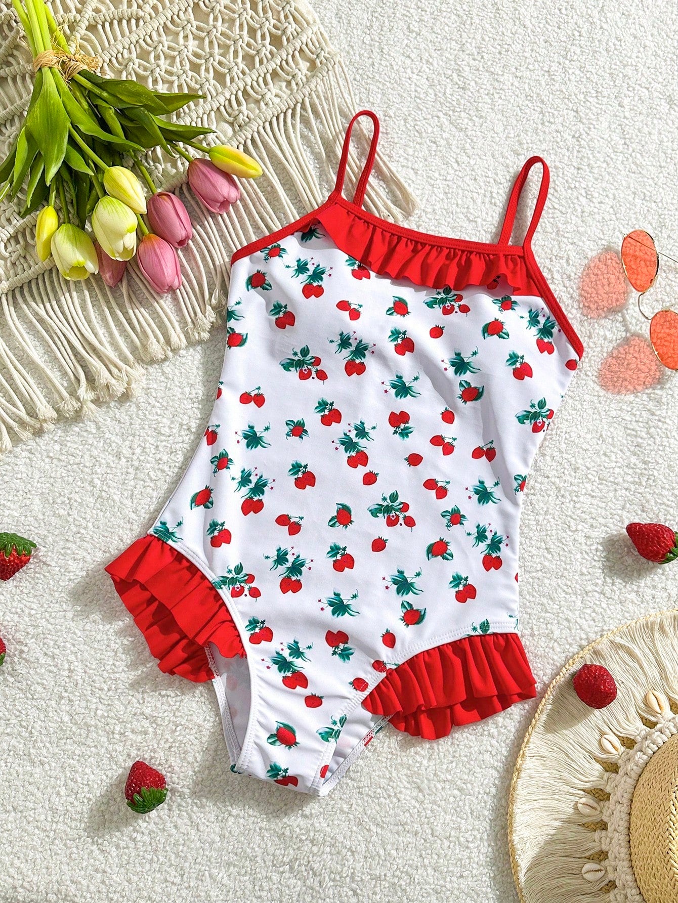 Tween girl plaid all-over print one-piece swimsuit with ruffle detail, spaghetti straps, fitted shape, and multicolor patchwork style for beach or pool wear.