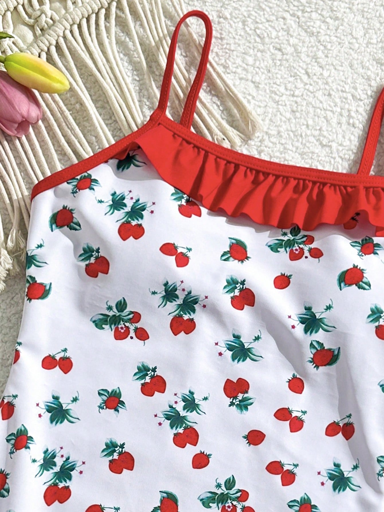 Tween girl plaid all-over print one-piece swimsuit with ruffle detail, spaghetti straps, fitted shape, and multicolor patchwork style for beach or pool wear.