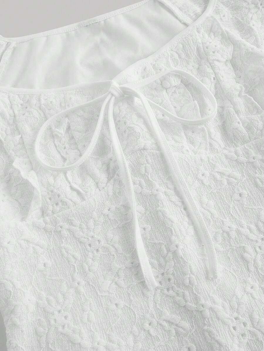 White eyelet lace A-line mini dress for tween girls with short puff sleeves, sweetheart neckline, high waist, and flared hem