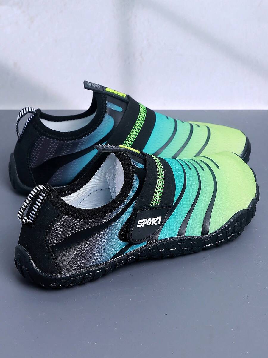 Boys orange lightweight sports water shoes featuring breathable mesh upper, hook loop closure, colorblock design, and non-slip rubber outsole.