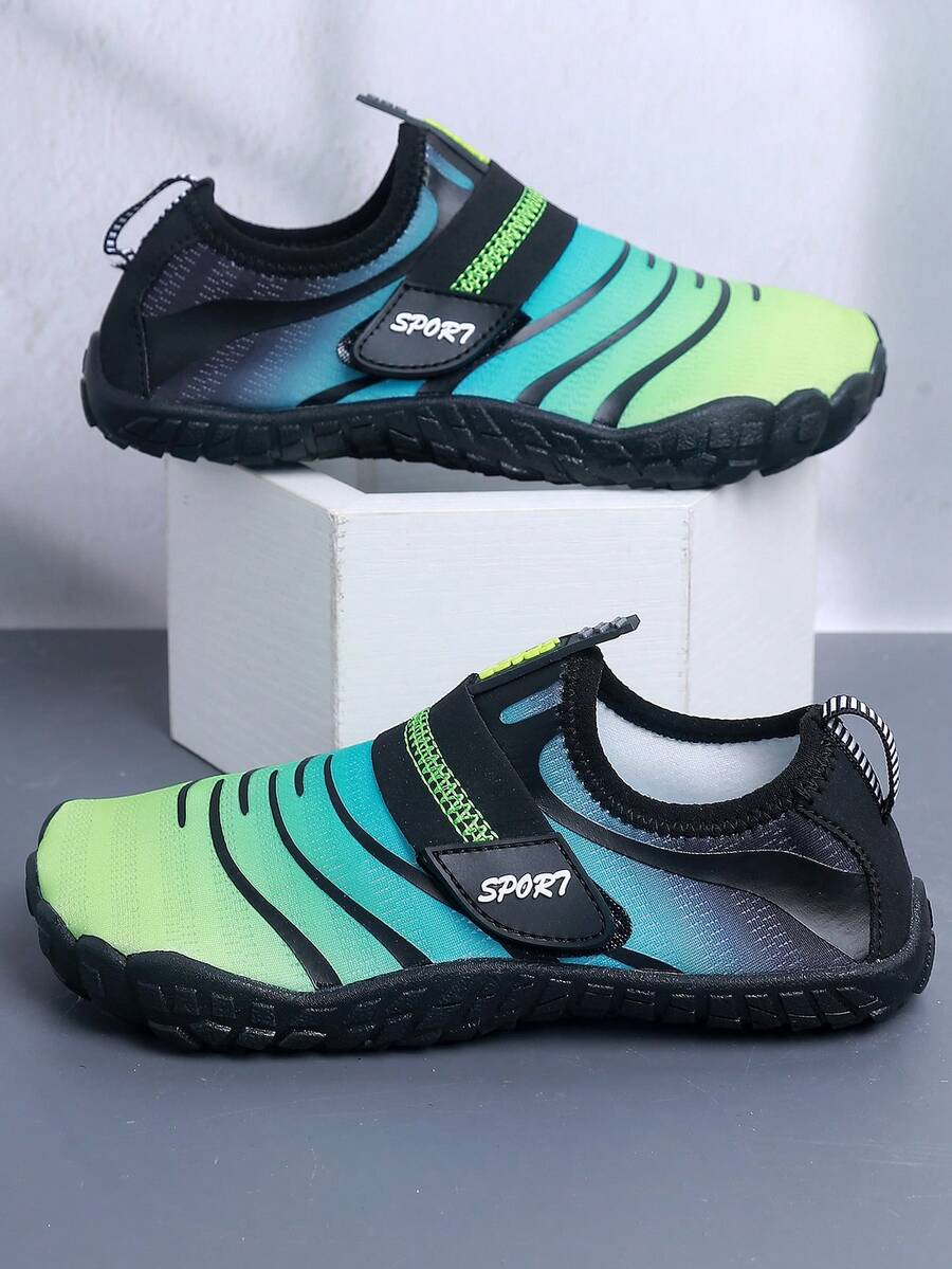 Boys orange lightweight sports water shoes featuring breathable mesh upper, hook loop closure, colorblock design, and non-slip rubber outsole.
