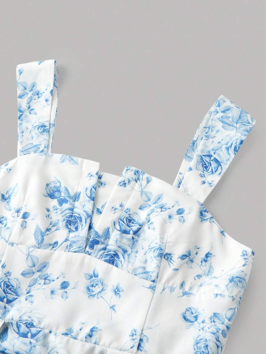 Tween girl apricot floral print midi dress with ruffle shoulder straps, shirred detail, and high waist A-line fit.