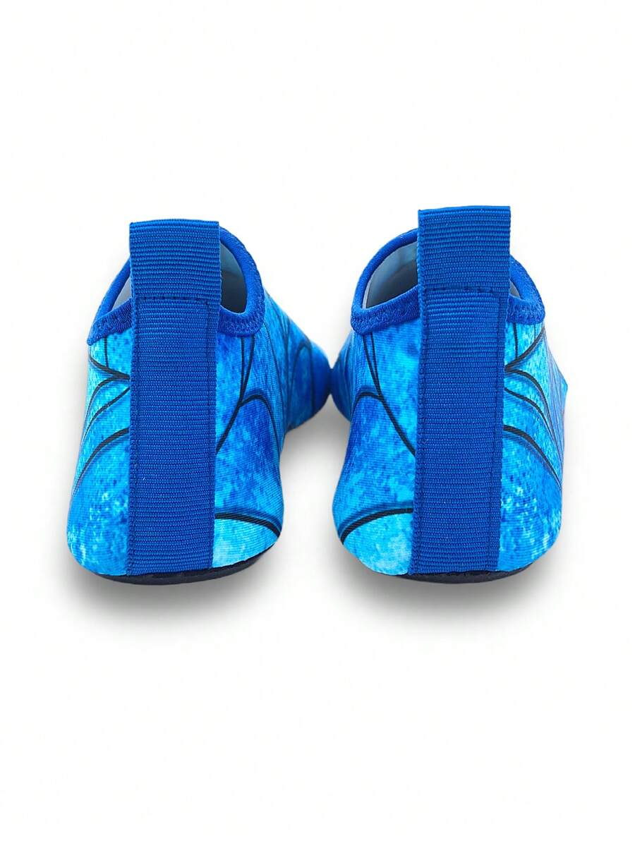 Boys red slip-on water shoes with spider pattern, breathable fabric upper, contrast binding details, and soft TPR outsole.