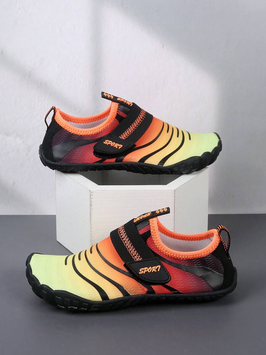 Boys orange lightweight sports water shoes featuring breathable mesh upper, hook loop closure, colorblock design, and non-slip rubber outsole.