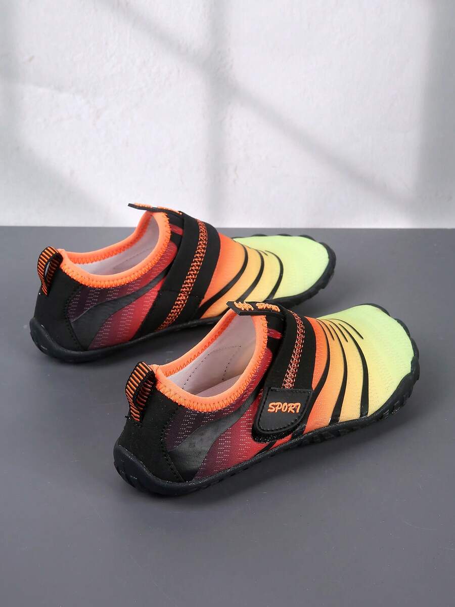 Boys orange lightweight sports water shoes featuring breathable mesh upper, hook loop closure, colorblock design, and non-slip rubber outsole.