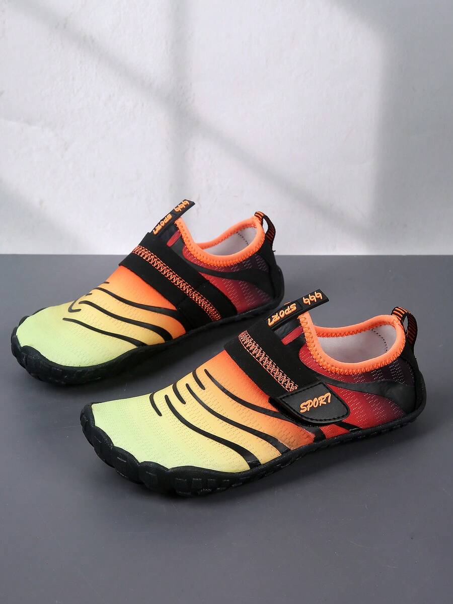 Boys orange lightweight sports water shoes featuring breathable mesh upper, hook loop closure, colorblock design, and non-slip rubber outsole.