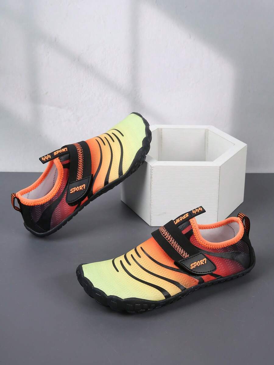 Boys orange lightweight sports water shoes featuring breathable mesh upper, hook loop closure, colorblock design, and non-slip rubber outsole.