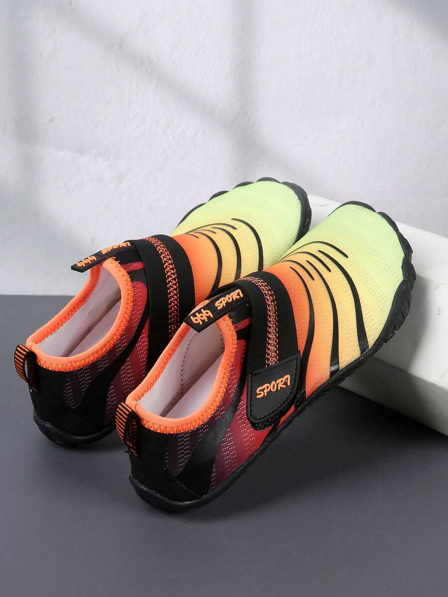 Boys orange lightweight sports water shoes featuring breathable mesh upper, hook loop closure, colorblock design, and non-slip rubber outsole.