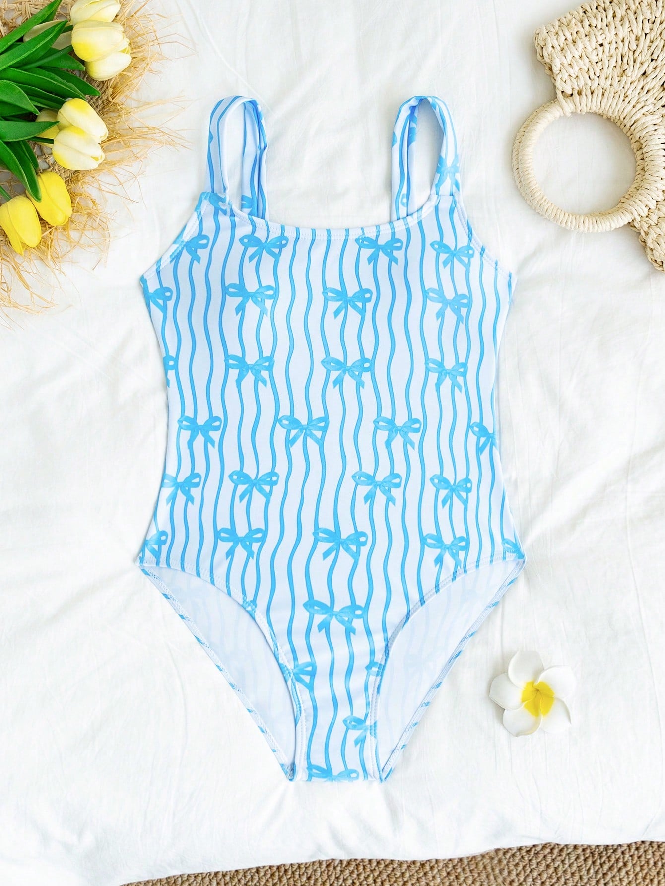 Tween girls one-piece swimsuit in mauve purple with all-over print, spaghetti straps, short length, and vacation swimwear style for beach, pool, and summer swimming.