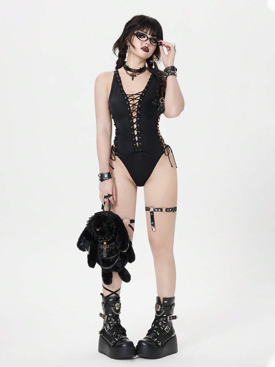 Black rock style goth halter one-piece swimsuit for women featuring metal grommet criss-cross lace-up detail.