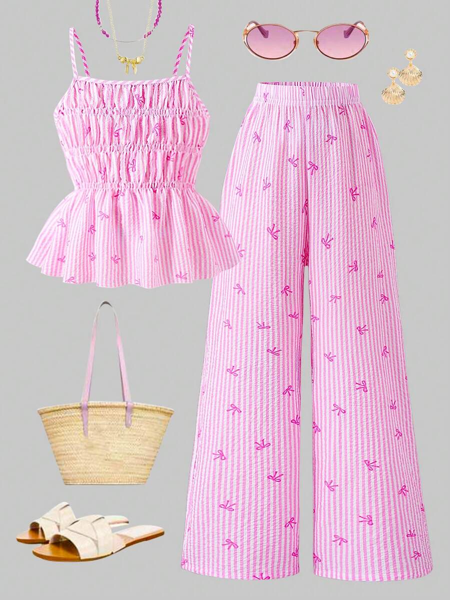 Girls 2-piece summer outfit set featuring a blue bow print camisole top with spaghetti straps and matching high-waisted straight leg pants.