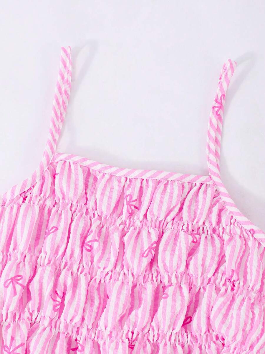 Girls 2-piece summer outfit set featuring a blue bow print camisole top with spaghetti straps and matching high-waisted straight leg pants.