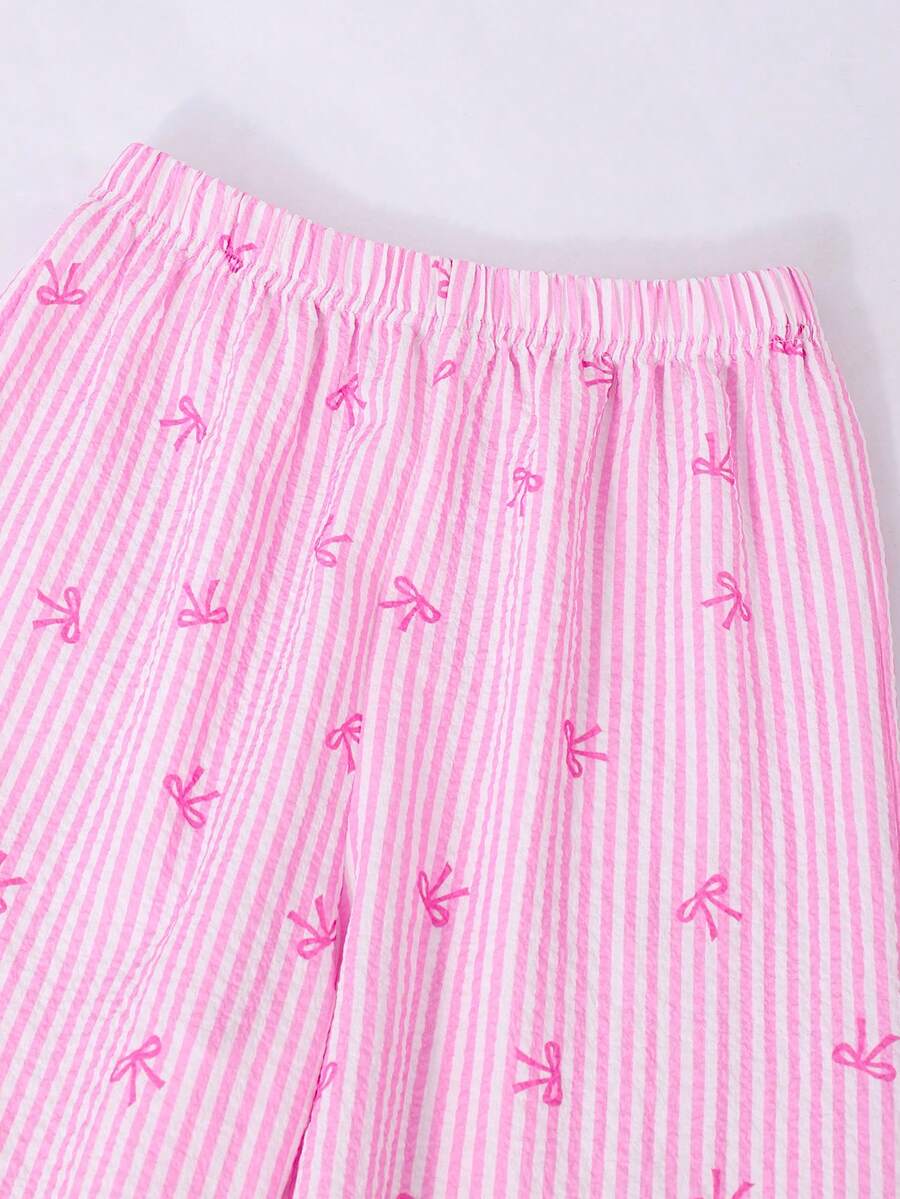 Girls 2-piece summer outfit set featuring a blue bow print camisole top with spaghetti straps and matching high-waisted straight leg pants.