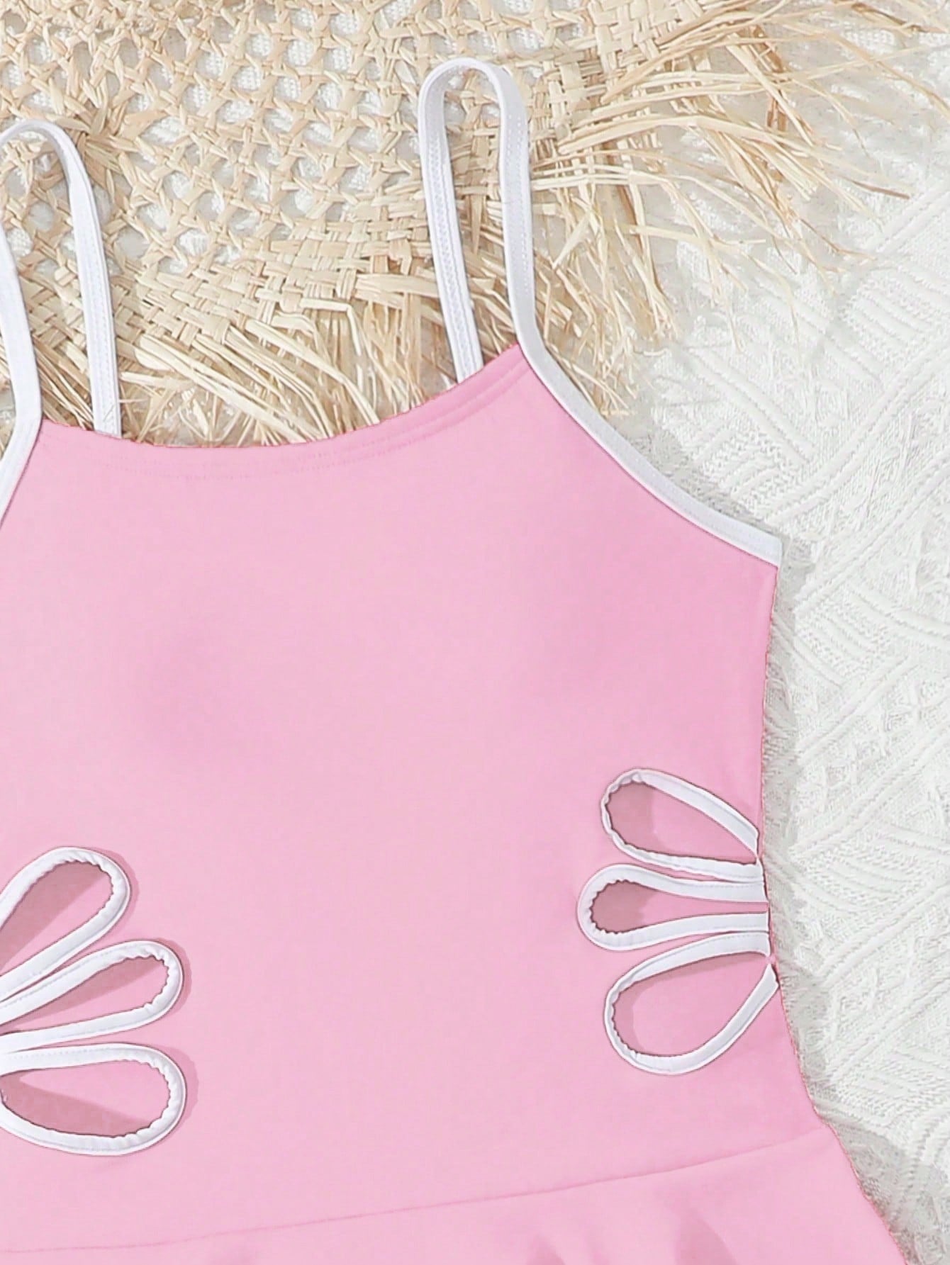 Tween girls black two-piece tankini swimwear set featuring a spaghetti strap sleeveless top with cutout detail and contrast piping, paired with short swim shorts.