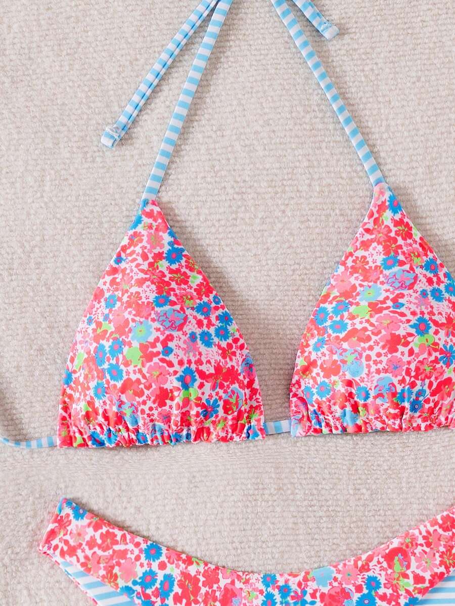 Women's two-piece halter bikini set featuring high cut thong bottoms and removable padding