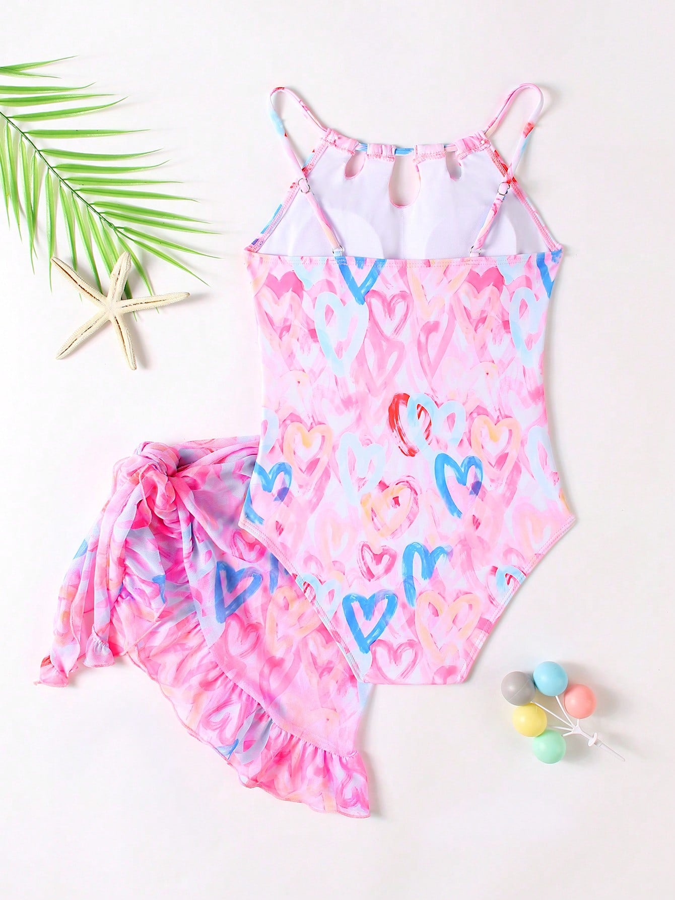 Girls black and white one-piece swimsuit set with cut-out detail, spaghetti straps, sleeveless fitted design, and matching skirt bottom for vacation swimwear.
