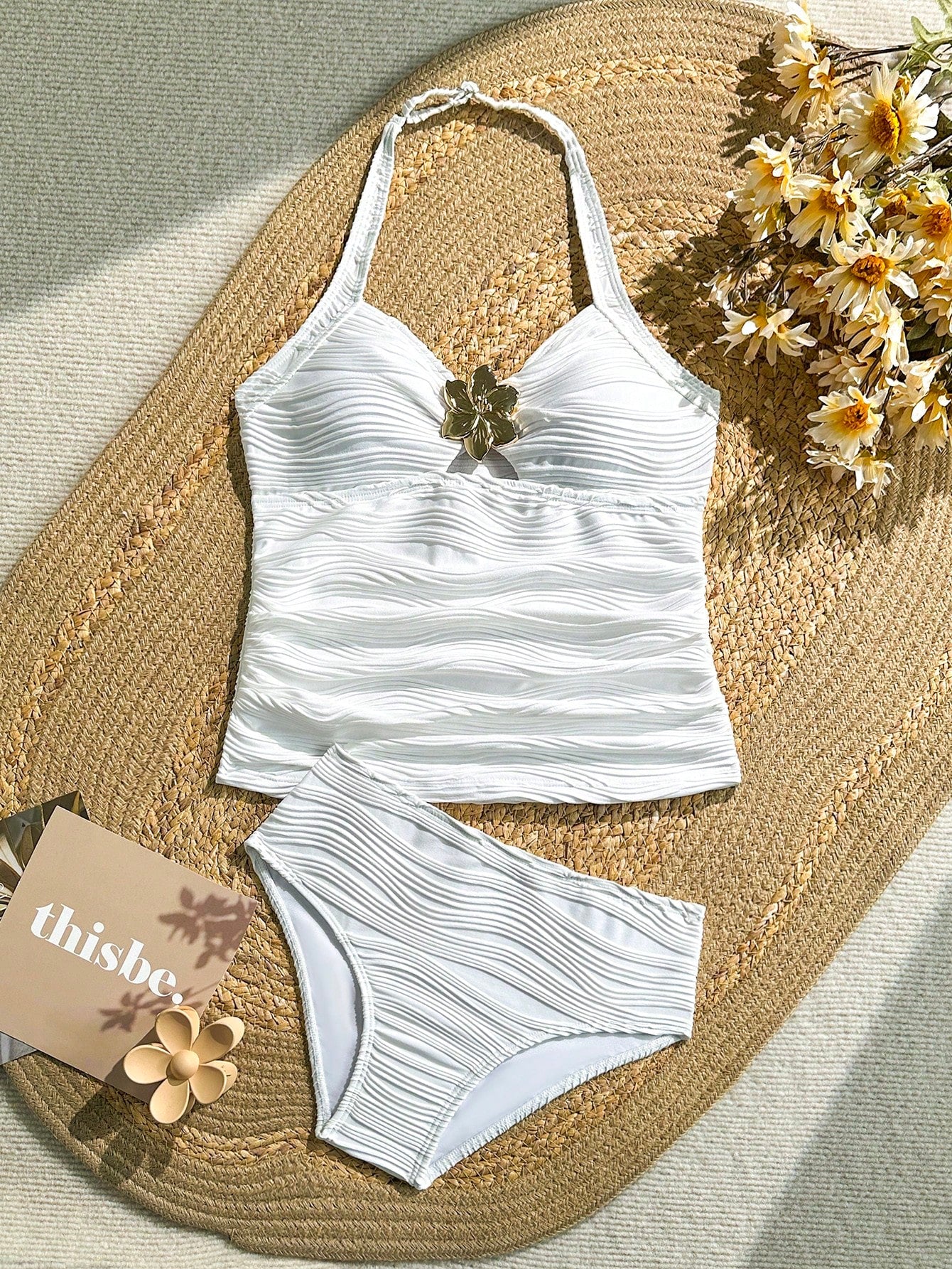 Tween girls 2-piece bikini swimwear set in black with a wave-pattern geometric design, featuring halter neckline, wireless top, and high-waist short bottoms with starfish and shell decor.