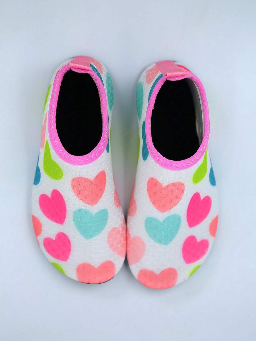 Kids slip-on aqua socks featuring geometric pattern, breathable Lycra upper, and non-slip TPR outsole for beach and water activities.