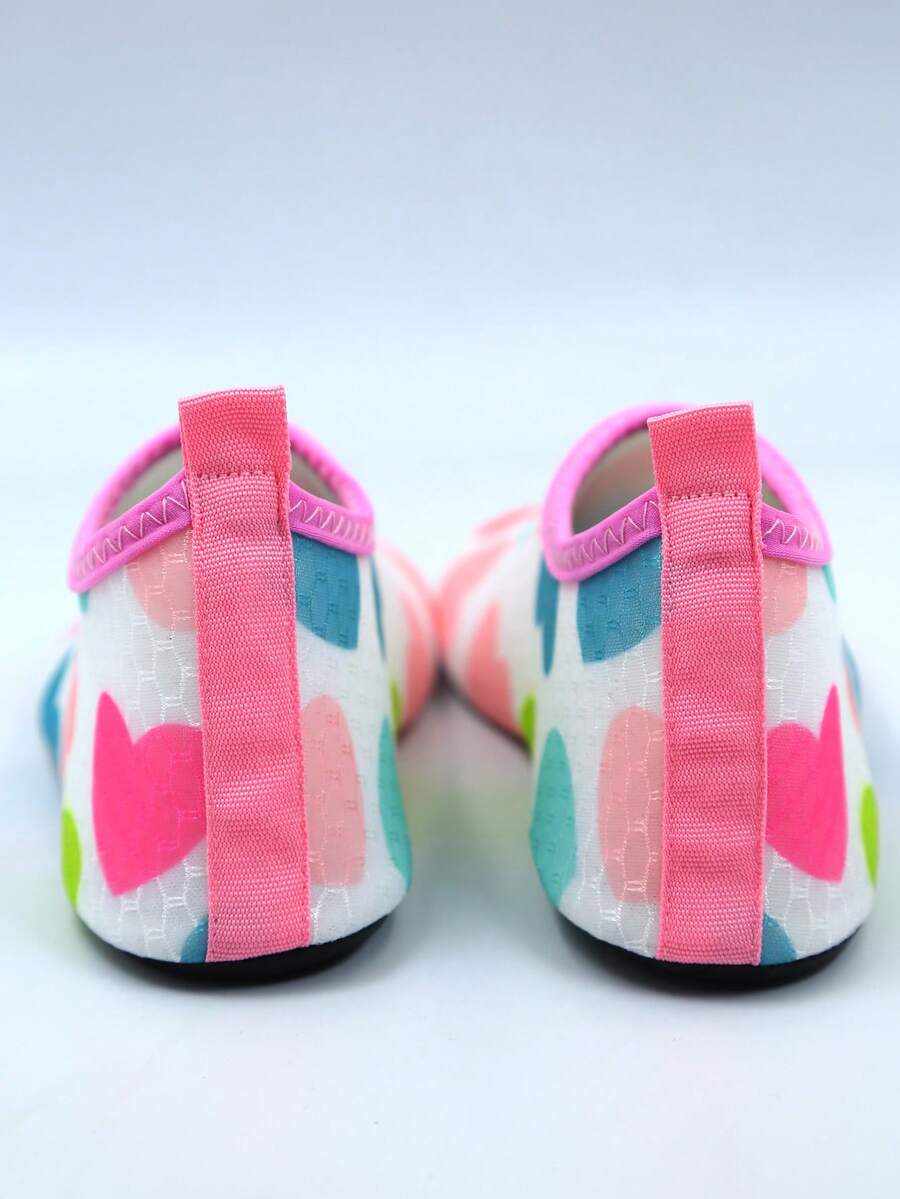 Kids slip-on aqua socks featuring geometric pattern, breathable Lycra upper, and non-slip TPR outsole for beach and water activities.