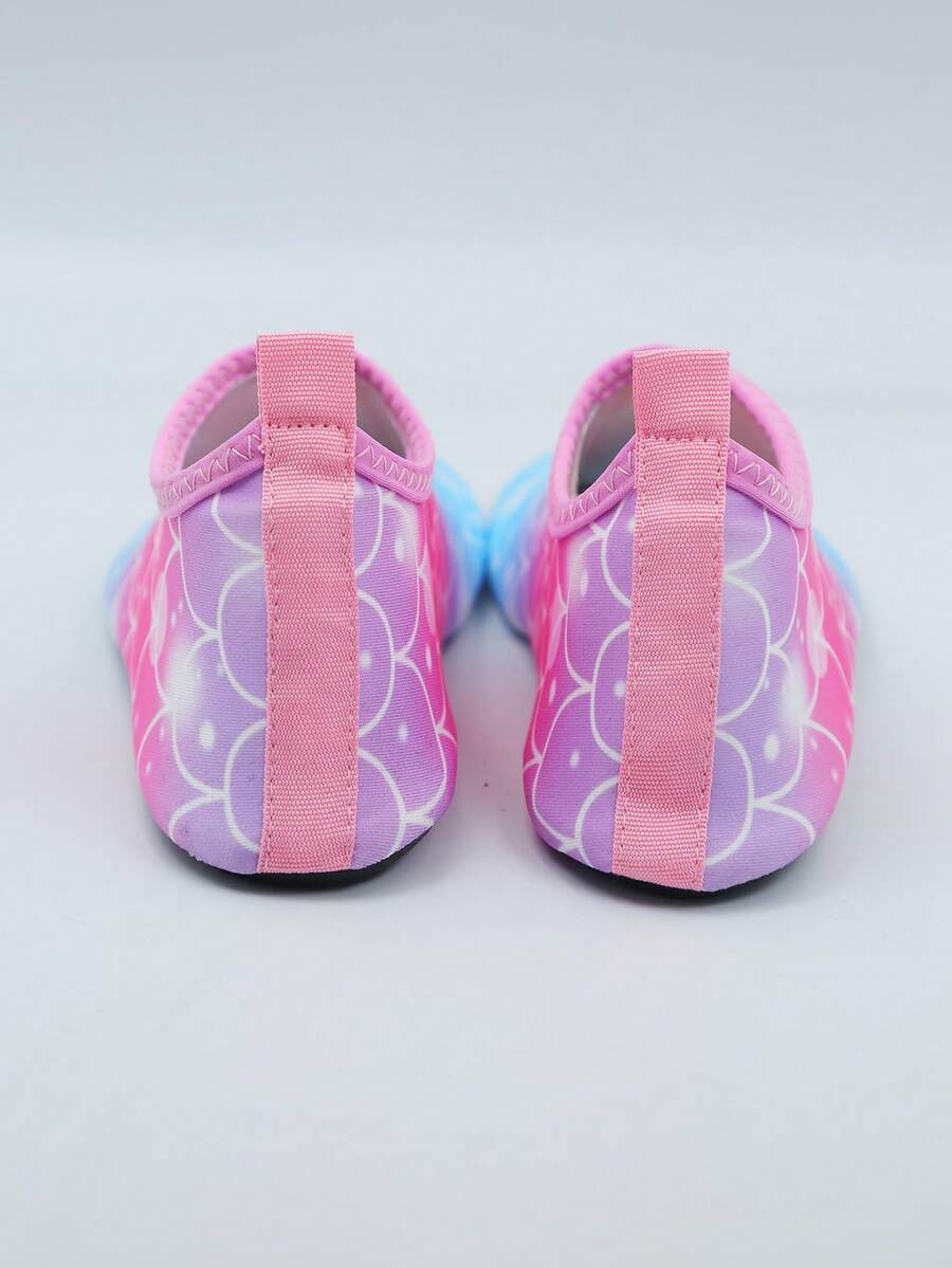Kids slip-on aqua socks water shoes with breathable polyester upper and non-slip wear-resistant TPR outsole for boys and girls.