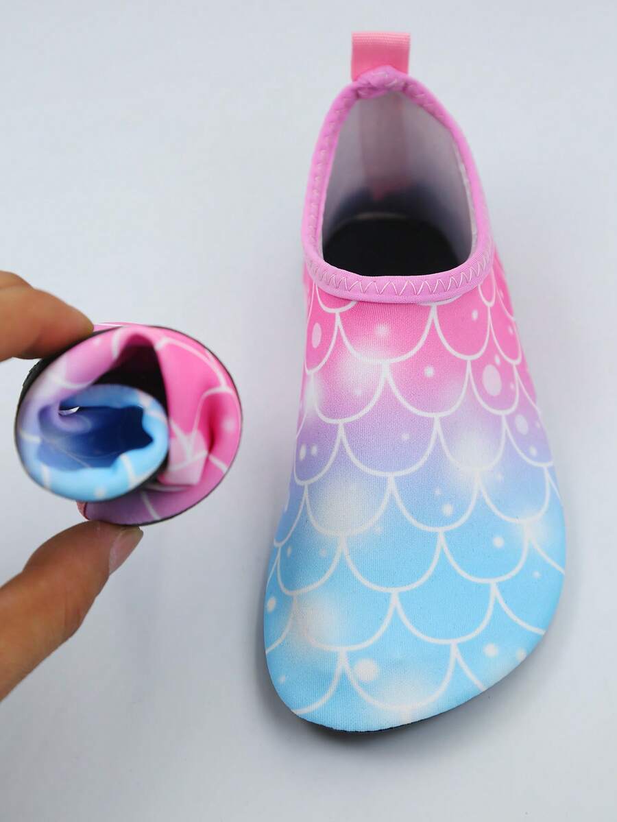 Kids slip-on aqua socks water shoes with breathable polyester upper and non-slip wear-resistant TPR outsole for boys and girls.