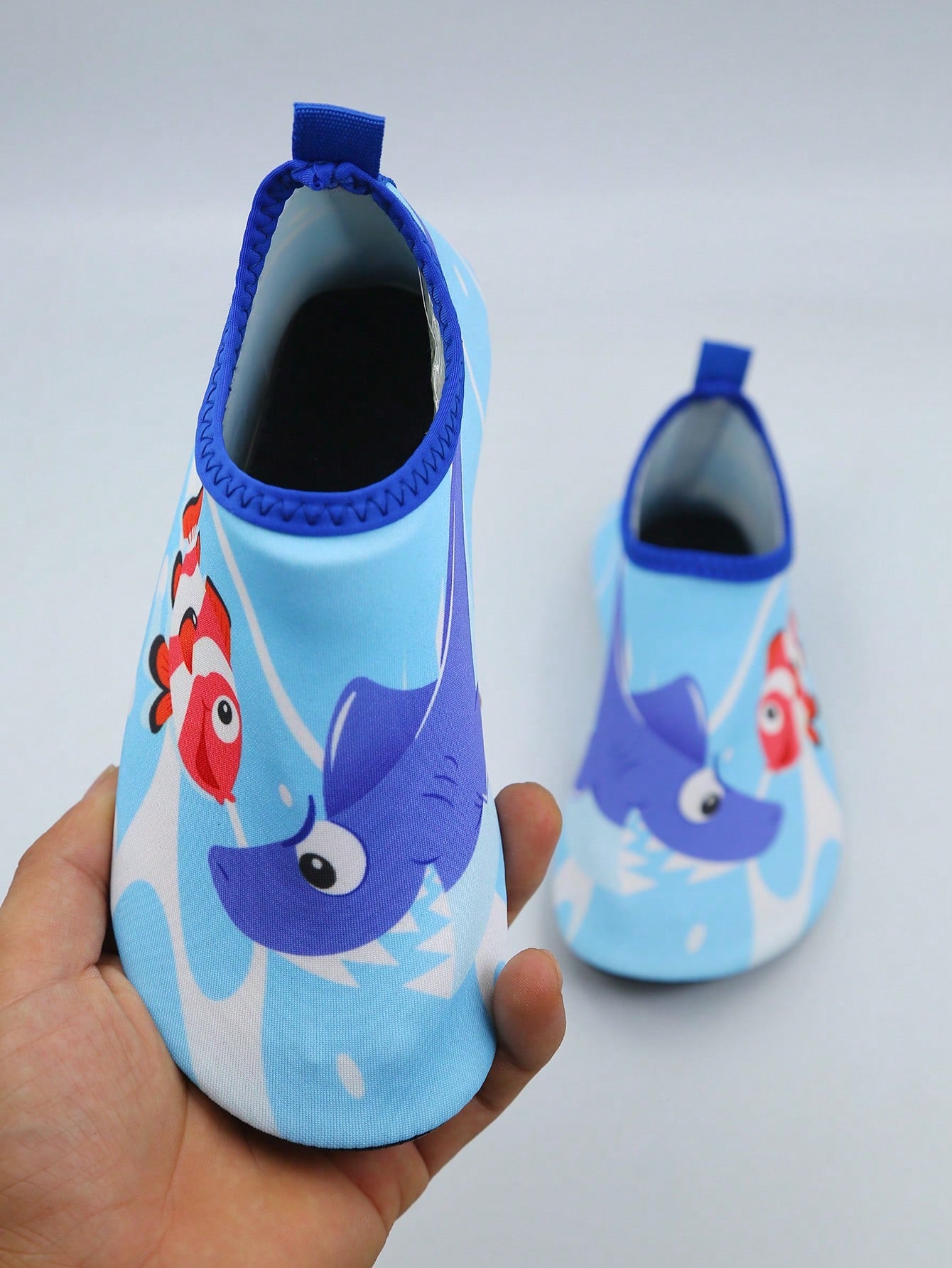 Kids slip-on aqua socks water shoes with breathable polyester upper and non-slip wear-resistant TPR outsole for boys and girls.
