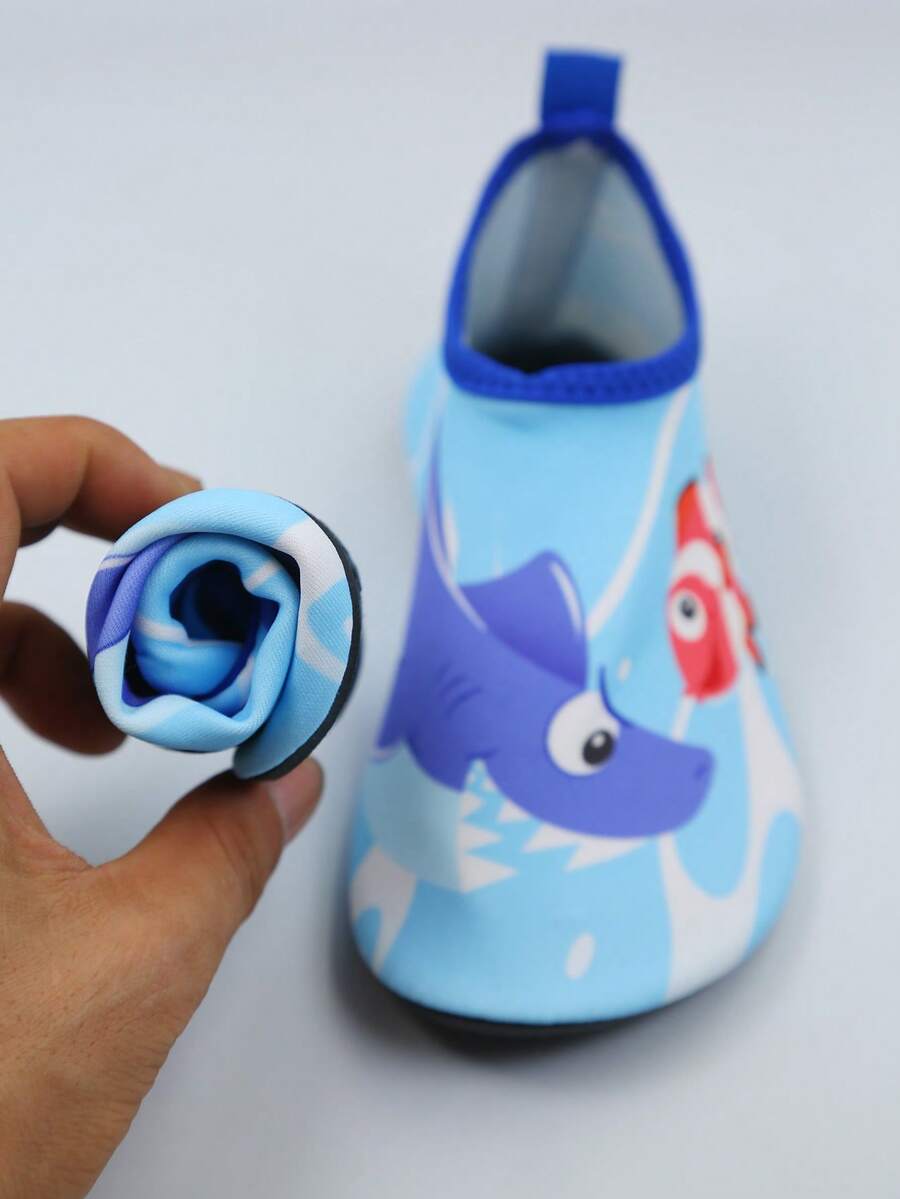 Kids slip-on aqua socks water shoes with breathable polyester upper and non-slip wear-resistant TPR outsole for boys and girls.