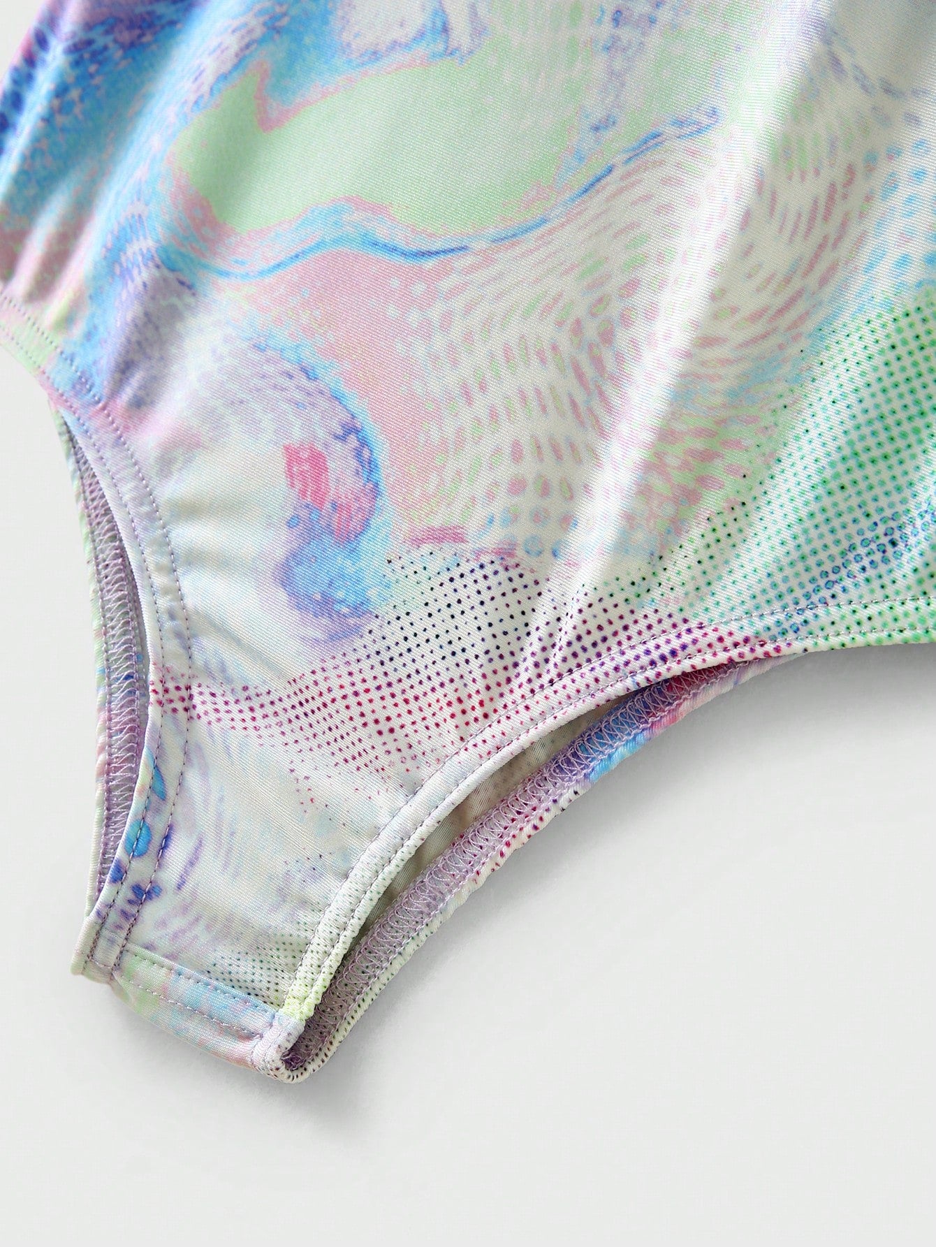 Multicolor tie-dye one-piece swimsuit for tween girls with scoop neck, wireless bra, mid-waist bottom, and high-stretch fabric