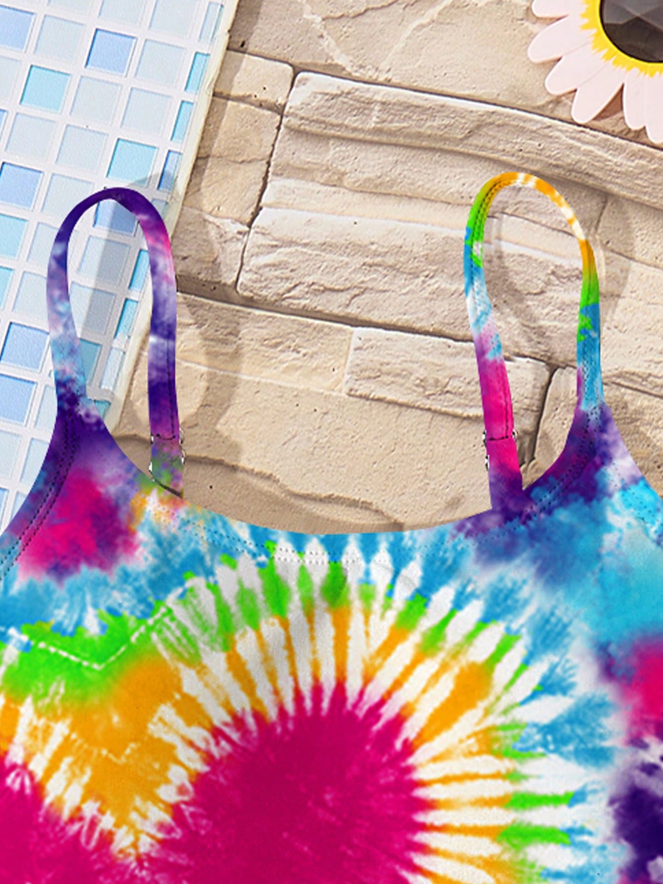 Tween girls multicolor one-piece swimsuit with cut-out detail, spaghetti straps, all-over tie-dye style print, and natural mid-waist bottom for beach and vacation wear.