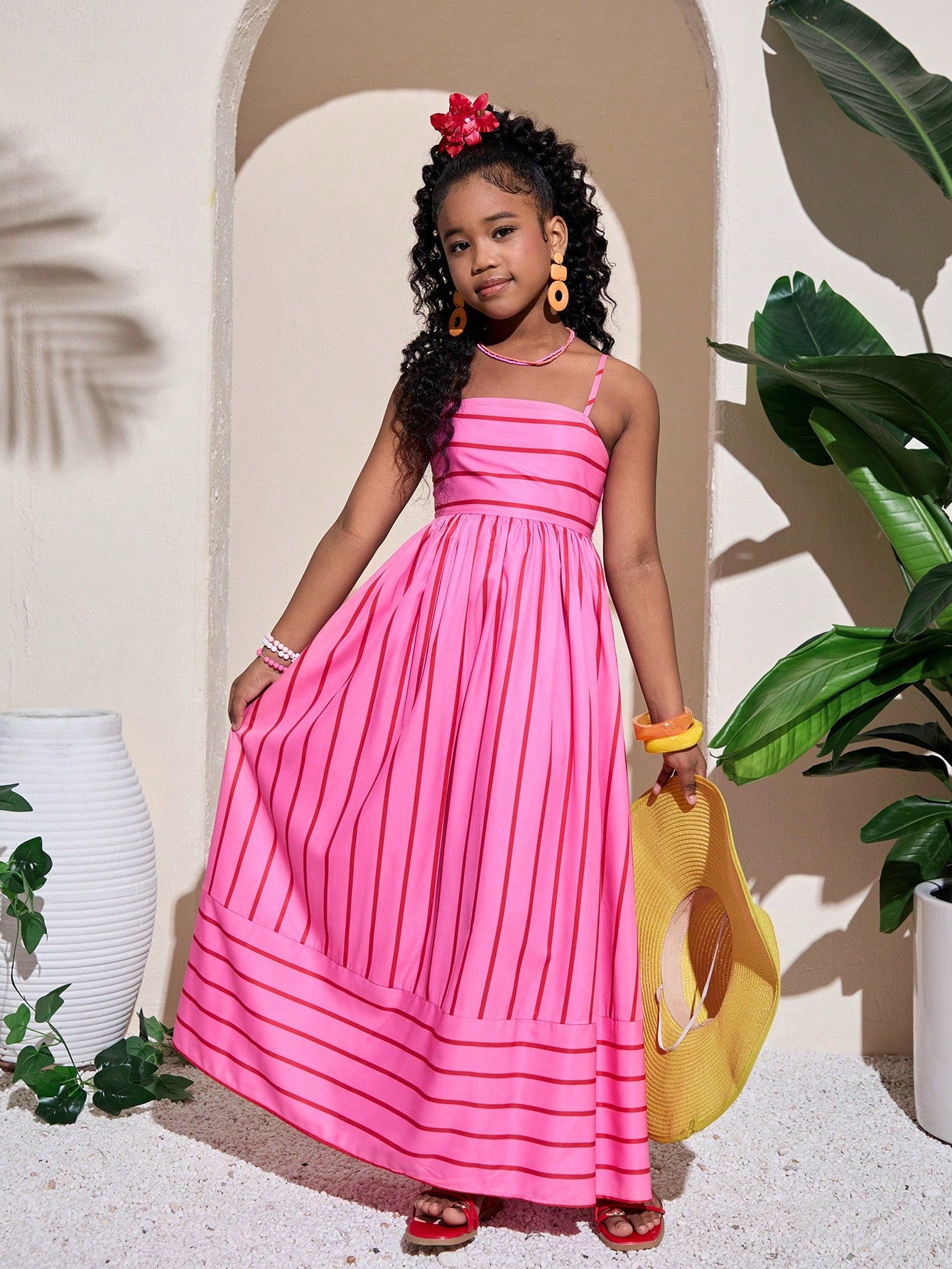 Tween girls striped spaghetti strap cami dress with high waist, shirred detail, zipper closure, sleeveless design, and flared long A-line silhouette for vacation wear.