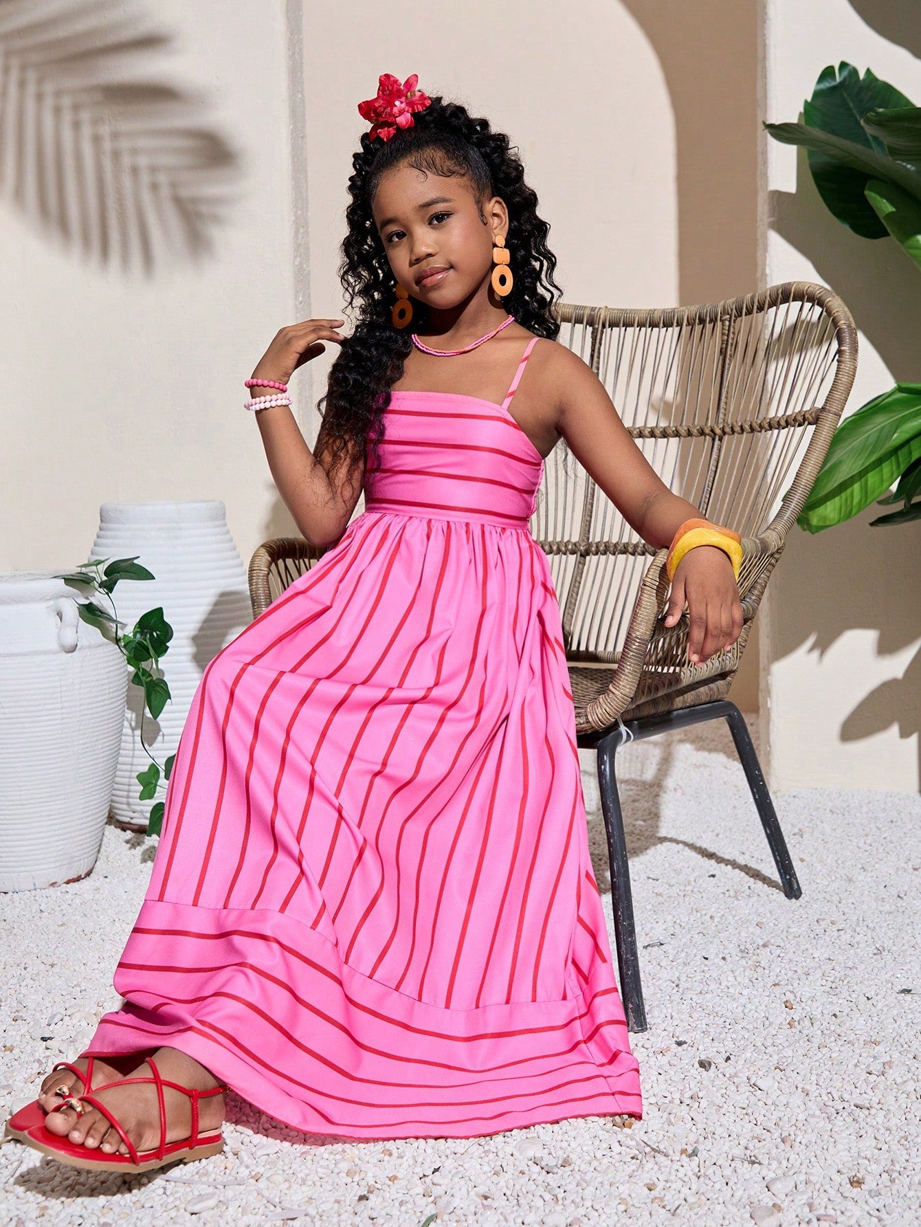 Tween girls striped spaghetti strap cami dress with high waist, shirred detail, zipper closure, sleeveless design, and flared long A-line silhouette for vacation wear.