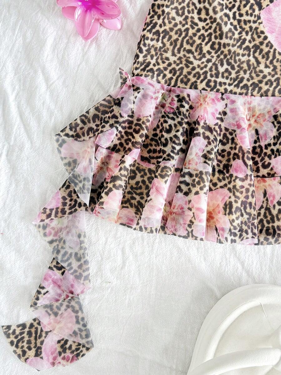 Pink sleeveless tween girls vacation cami dress with spaghetti straps, tiered layer detail, flounce ruffle hem, slim fit, and built-in shorts.