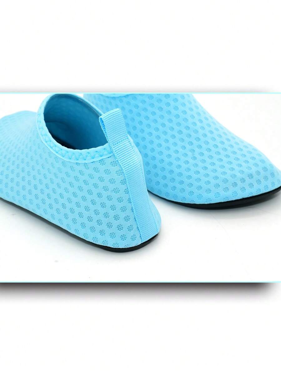 Boys breathable slip-on aqua water shoes featuring contrast binding and non-slip TPR soles for beach and outdoor activities.