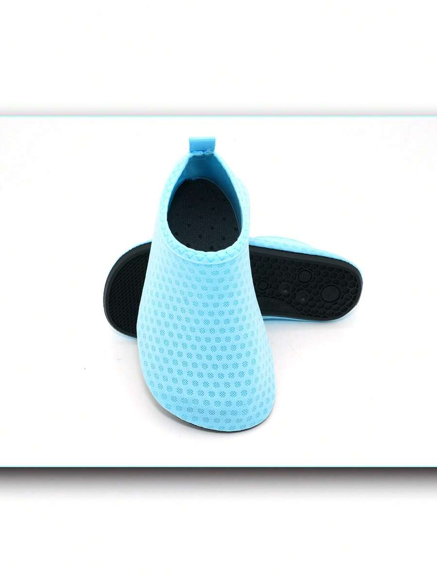 Boys breathable slip-on aqua water shoes featuring contrast binding and non-slip TPR soles for beach and outdoor activities.