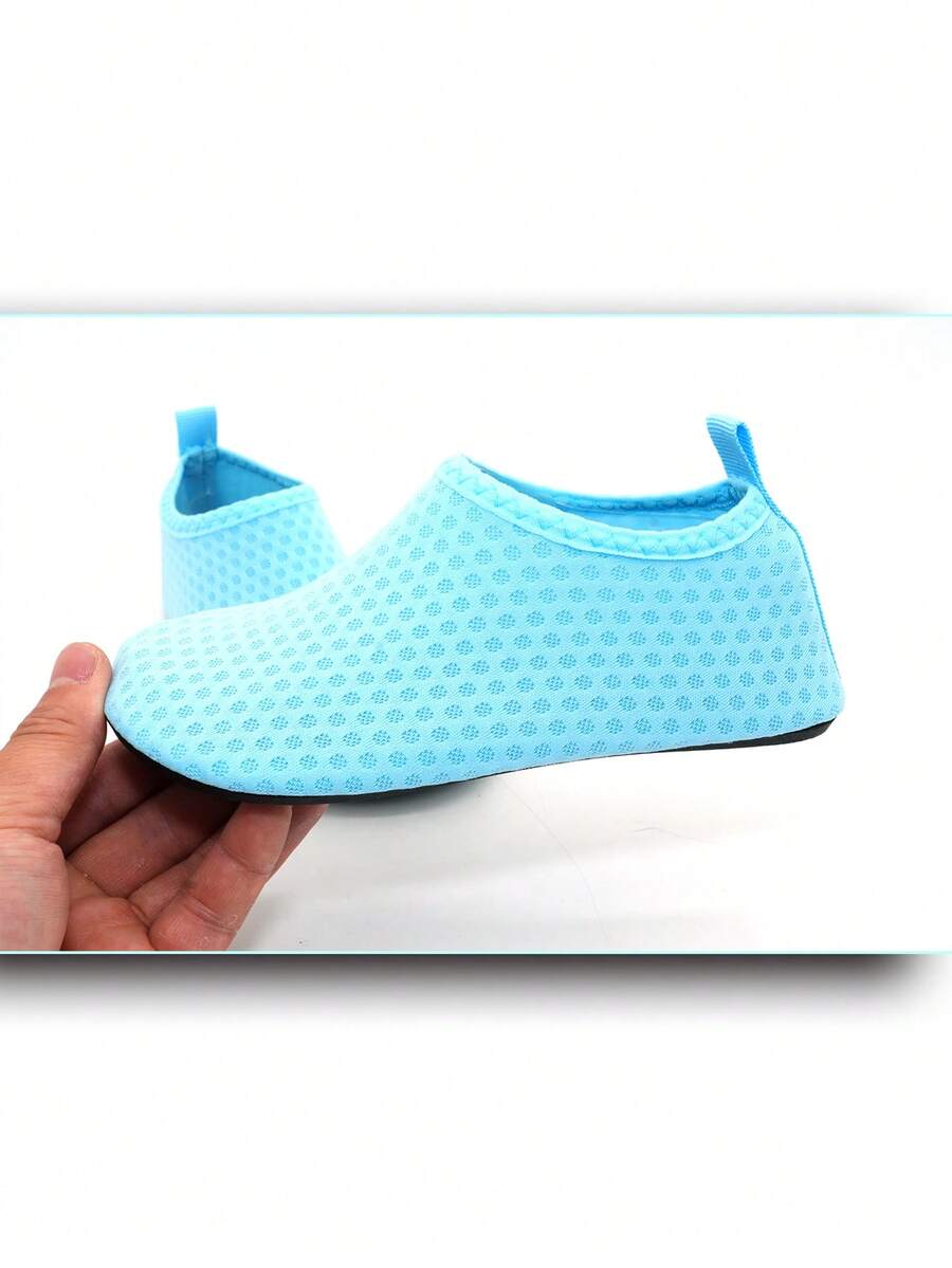 Boys breathable slip-on aqua water shoes featuring contrast binding and non-slip TPR soles for beach and outdoor activities.