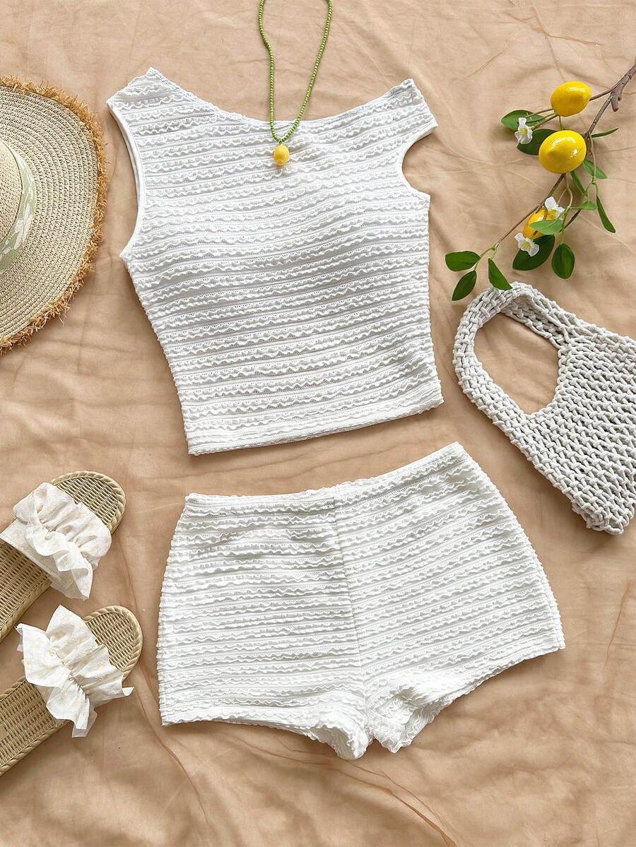 Tween girls 2-piece summer clothing set featuring a black asymmetric rib-knit striped off-shoulder t-shirt and matching slim fit shorts.