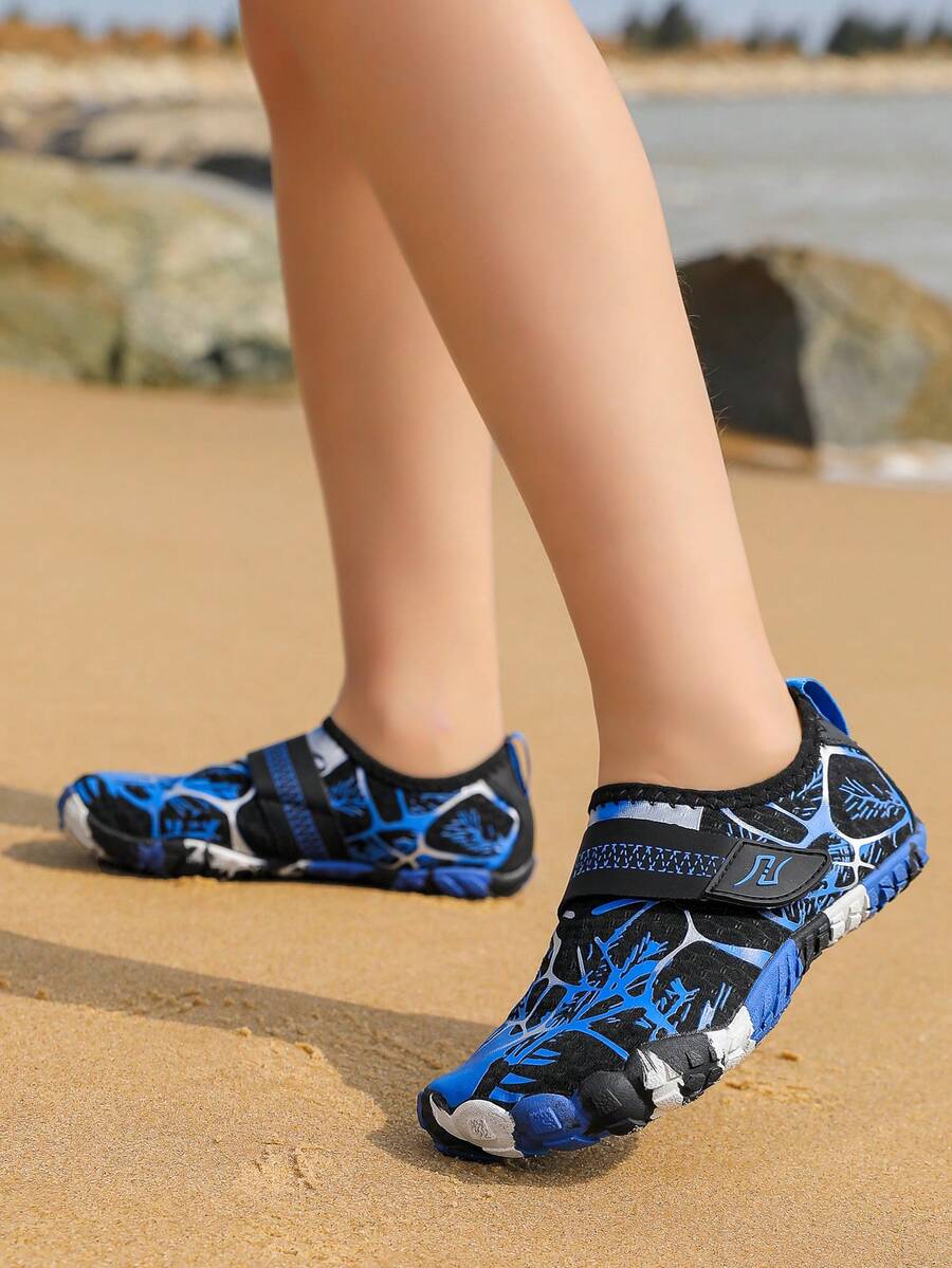 Black quick-dry kids water shoes featuring hook and loop closure and non-slip rubber outsole for boys and girls