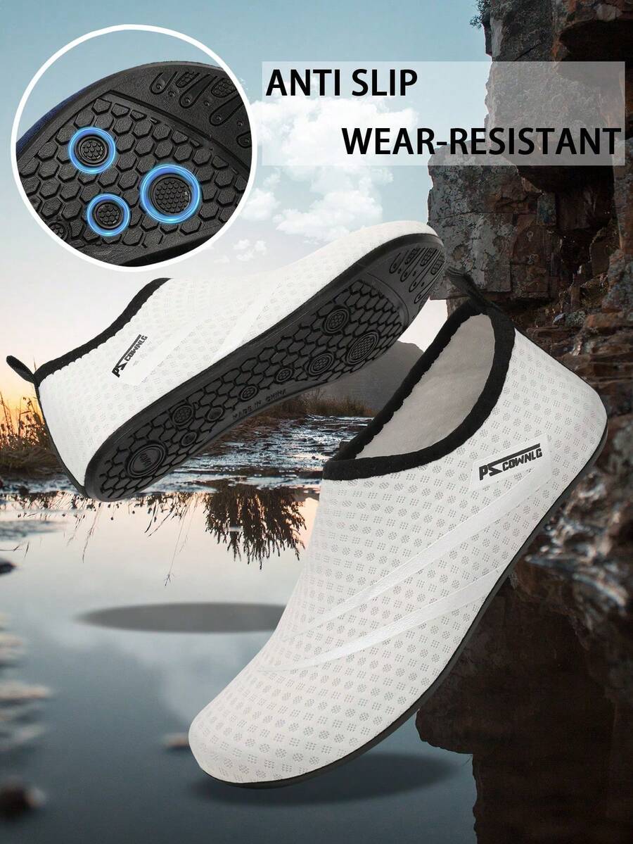 Black slip-on kids water shoes with a graphic pattern fabric upper and wear-resistant rubber outsole for boys and girls.