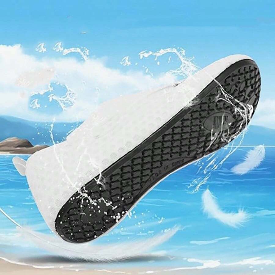 Black slip-on kids water shoes with a graphic pattern fabric upper and wear-resistant rubber outsole for boys and girls.