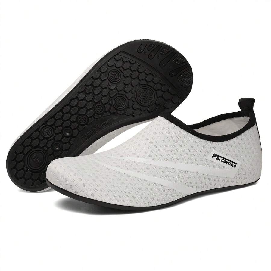 Black slip-on kids water shoes with a graphic pattern fabric upper and wear-resistant rubber outsole for boys and girls.