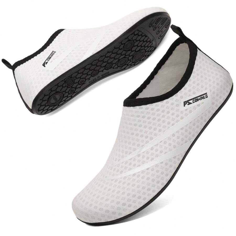 Black slip-on kids water shoes with a graphic pattern fabric upper and wear-resistant rubber outsole for boys and girls.