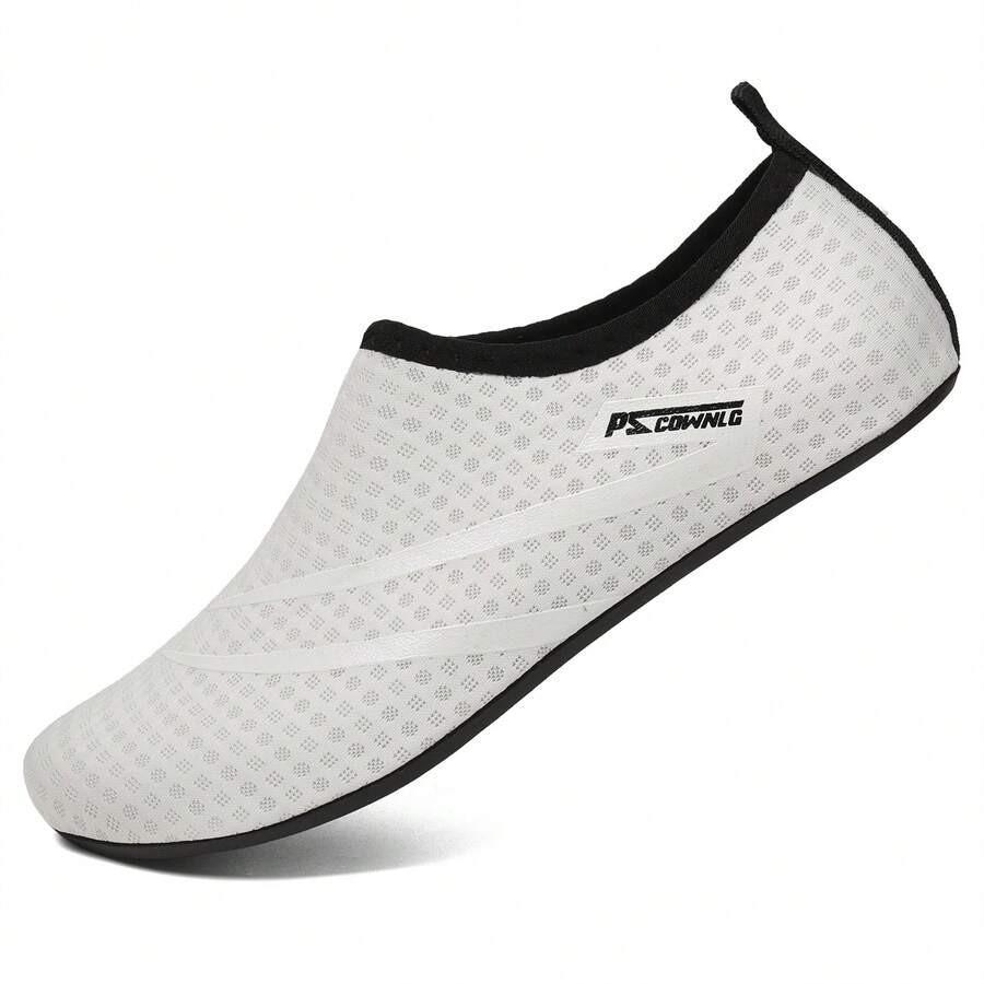 Black slip-on kids water shoes with a graphic pattern fabric upper and wear-resistant rubber outsole for boys and girls.