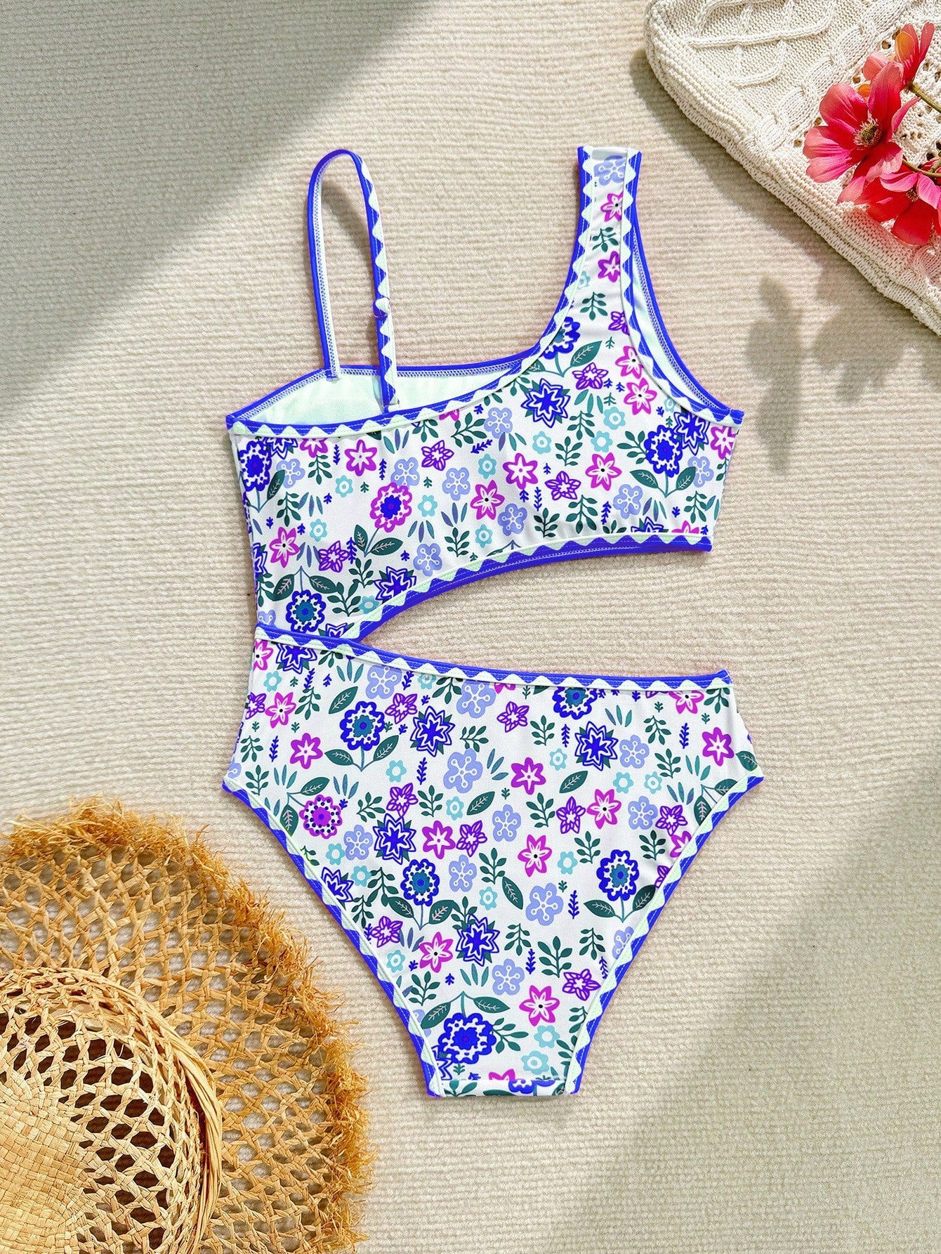 Tween girl one-piece swimsuit with floral plant print, asymmetrical neckline, cut-out detail, and fitted high-stretch design for beach and pool wear