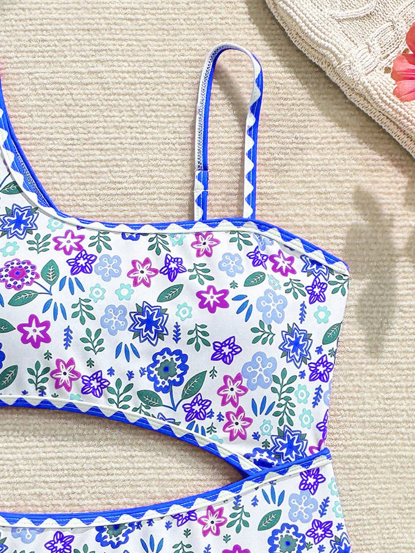 Tween girl one-piece swimsuit with floral plant print, asymmetrical neckline, cut-out detail, and fitted high-stretch design for beach and pool wear