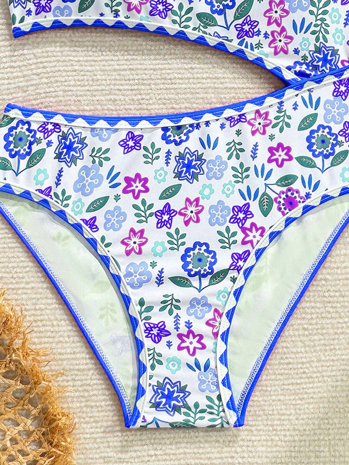 Tween girl one-piece swimsuit with floral plant print, asymmetrical neckline, cut-out detail, and fitted high-stretch design for beach and pool wear