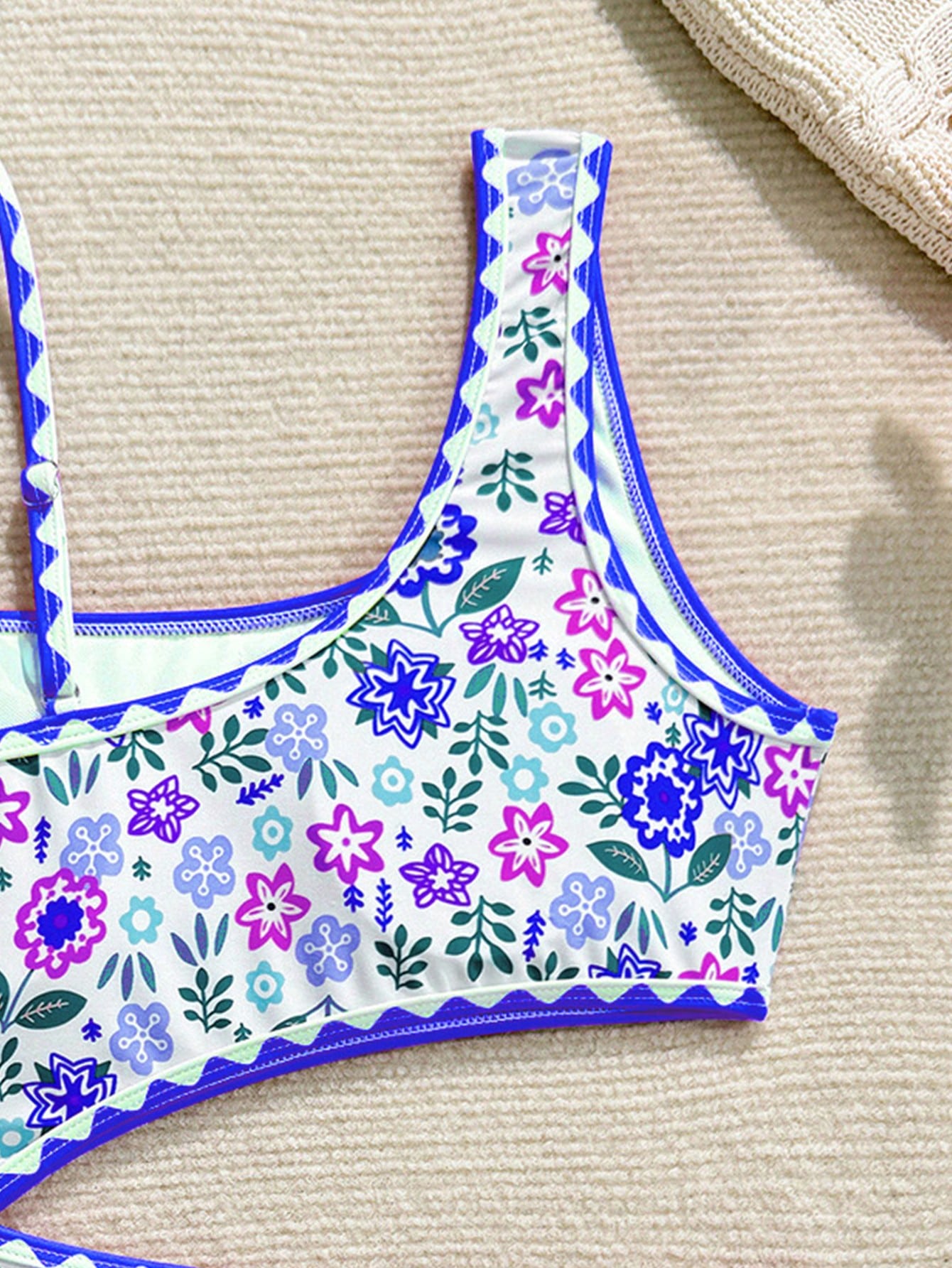 Tween girl one-piece swimsuit with floral plant print, asymmetrical neckline, cut-out detail, and fitted high-stretch design for beach and pool wear